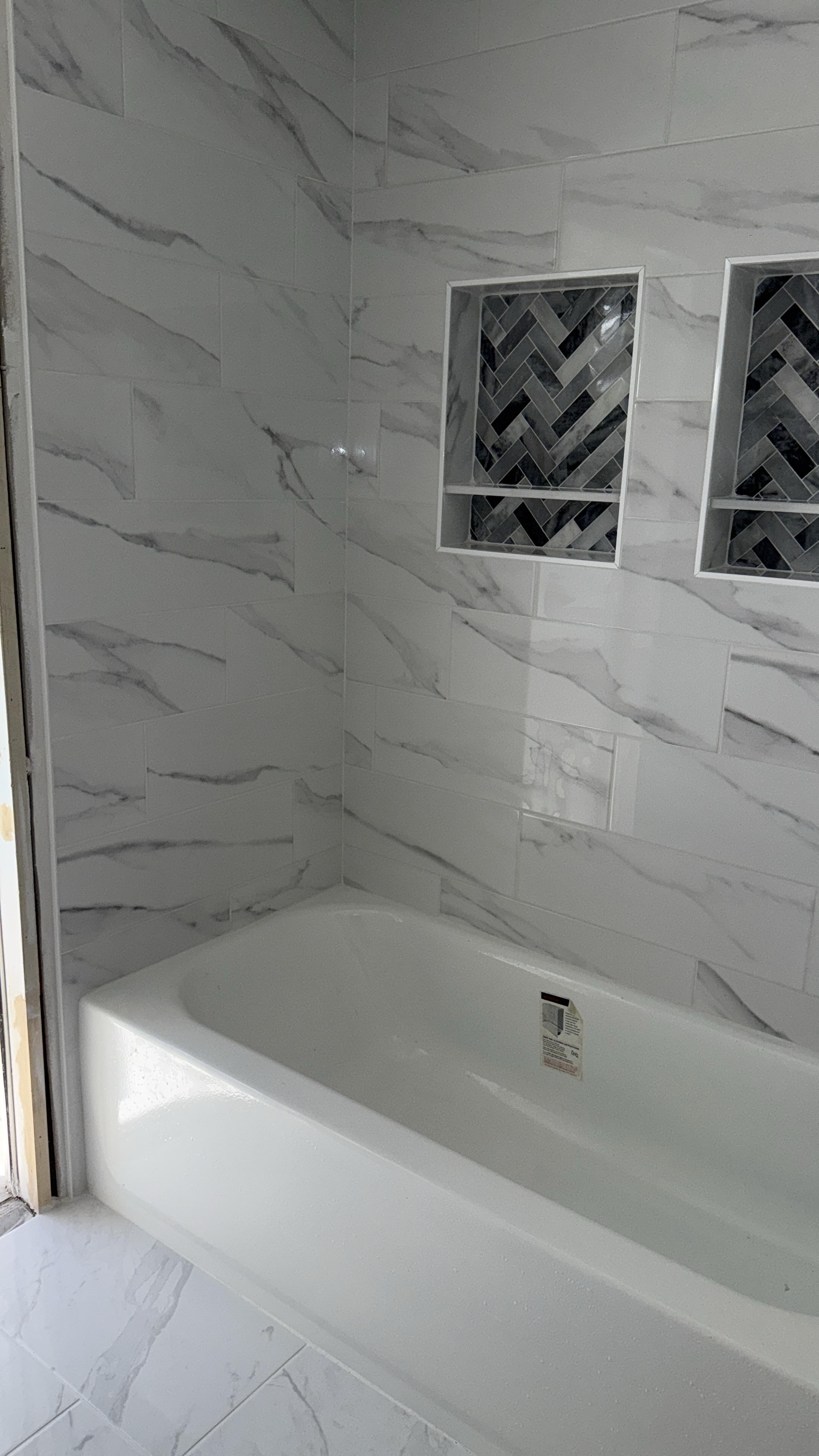 Finished tub and tile surround by C Level Remodeling